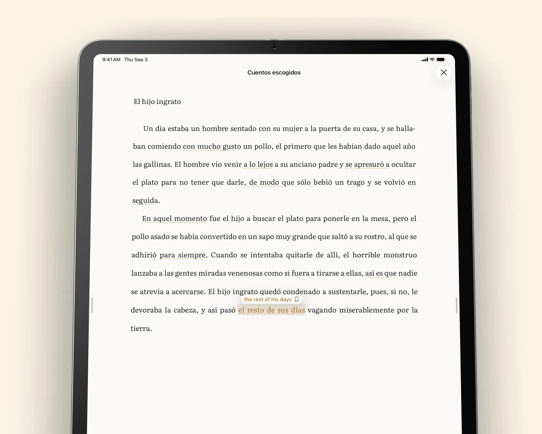 A phrase marked with an ochre dash in the reading page, glossed as a whole expression above the line.